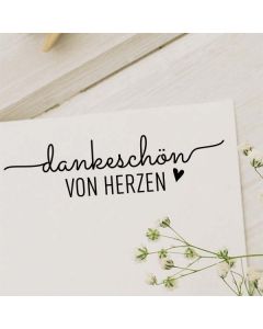 Holzstempel mit Text: dankeschön von Herzen  