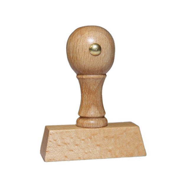 Holzstempel mit Text: Erledigt  